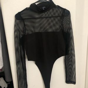 Fishnet , turtle neck body suit
